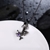 Picture of China No.1 Watches Export Purple Gunmetel Plated Necklaces & Pendants