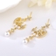 Show details for Delicate White Dangle Earrings of Original Design